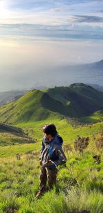 Full length of man on landscape against sky