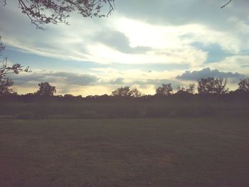 Scenic view of field against sky during sunset