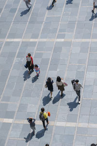 High angle view of people on footpath in city