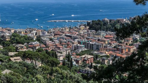 High angle view of townscape by sea