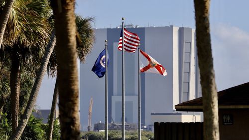 Flag on built structure against sky