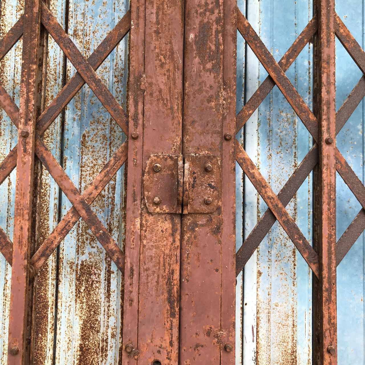 CLOSE-UP OF RUSTY METAL GATE