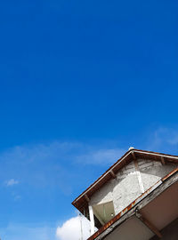 Low angle view of building against blue sky