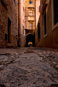 Man in front of residential buildings