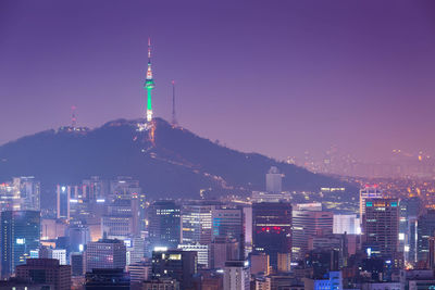 Illuminated buildings in city at night