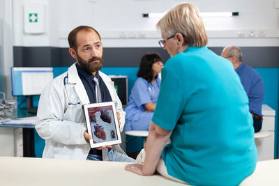 Doctor having discussion with patient at clinic