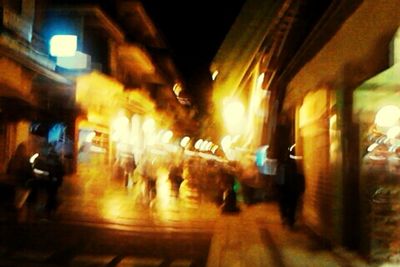 Street lights in illuminated city at night