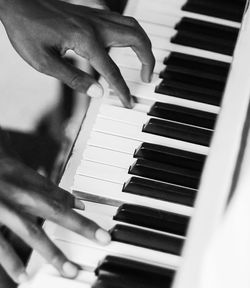 Cropped image of man playing guitar