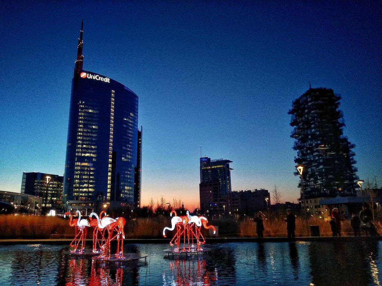 BUILDINGS IN CITY AT WATERFRONT