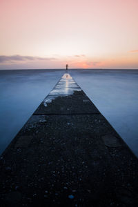 Scenic view of sea against sky at sunset