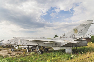 Old ukrainian jet plane stands at an abandoned airfield