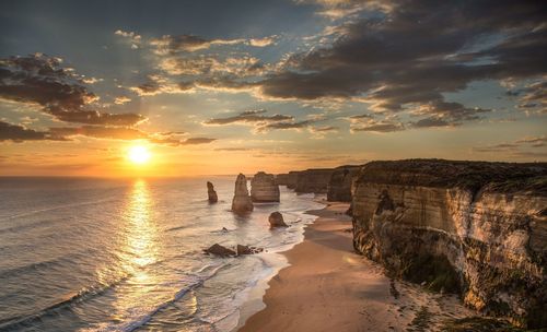 Scenic view of sea against dramatic sky