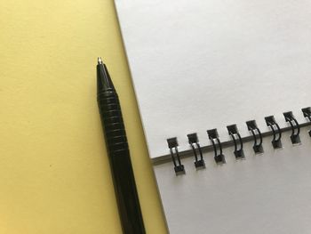 High angle view of pen on table against wall