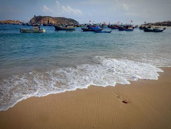 Scenic view of sea against cloudy sky