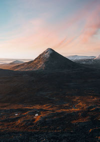 Scenic view of mountains against sky during sunset