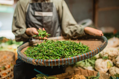 Midsection of man preparing food