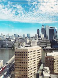 Modern buildings in city against sky