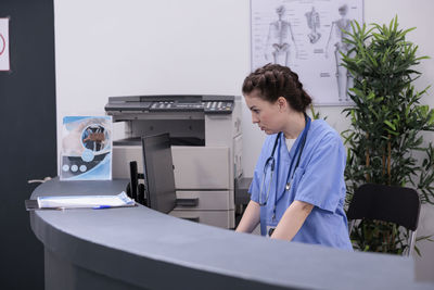 Portrait of doctor standing in office