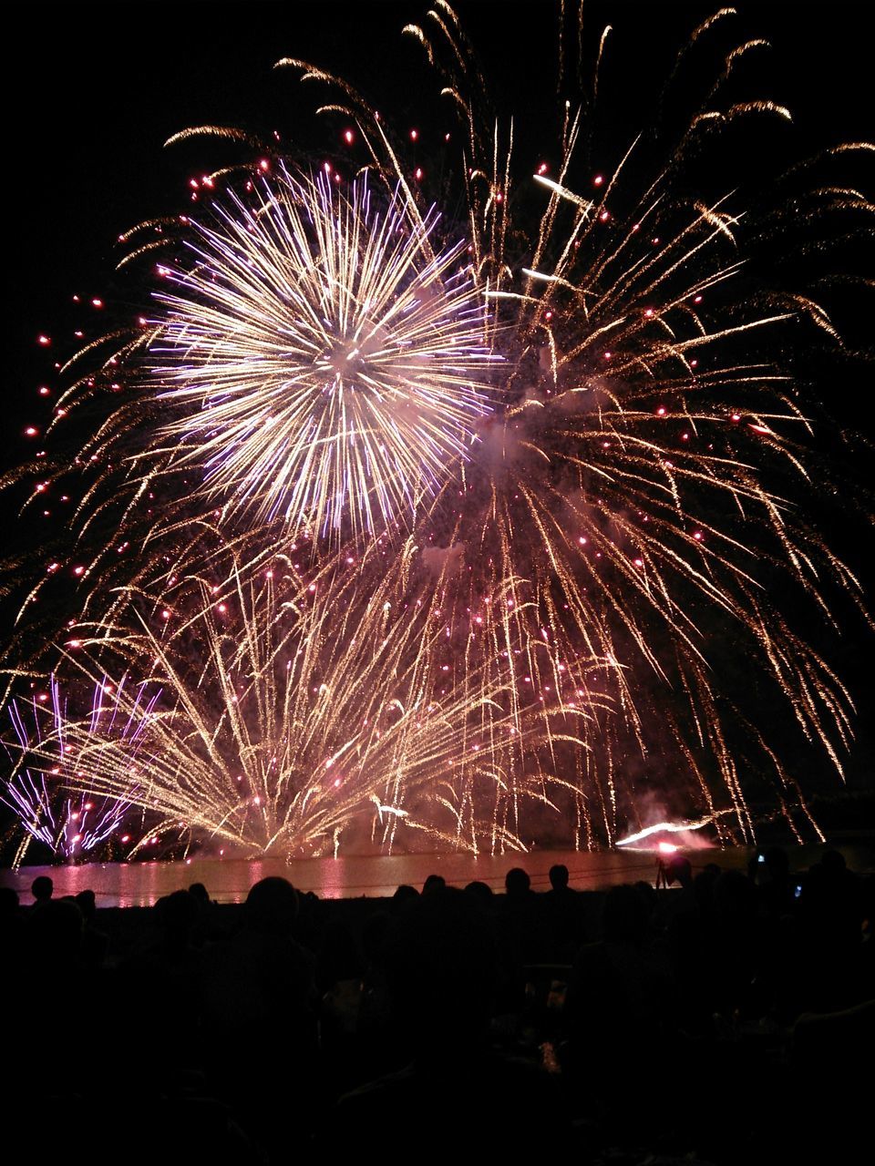 night, firework display, illuminated, celebration, exploding, long exposure, firework - man made object, motion, arts culture and entertainment, event, sparks, glowing, firework, entertainment, blurred motion, multi colored, sky, low angle view, celebration event, fire - natural phenomenon