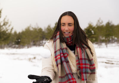 Smiling woman on snow