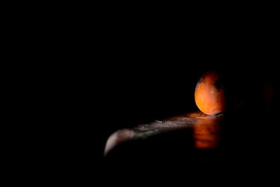 Close-up of fruit against black background