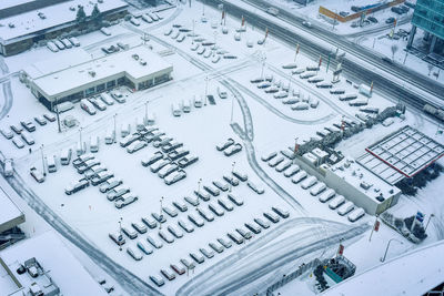 High angle view of snow covered buildings in city