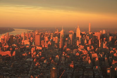 Aerial view of city during sunset