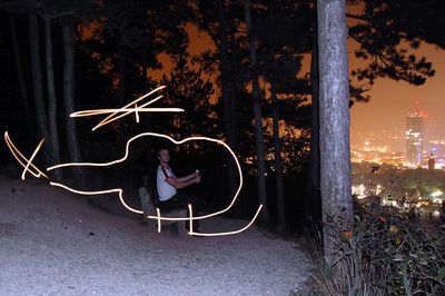 Text written on illuminated city at night