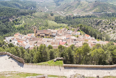 High angle view of townscape by mountain