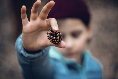 Close-up of hand holding girl