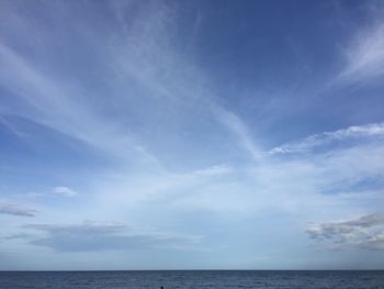 Scenic view of sea against blue sky