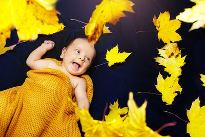 Portrait of girl with autumn leaves