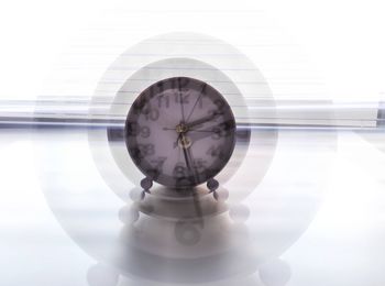 Close-up of clock on table