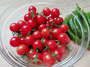 High angle view of cherries in bowl on table