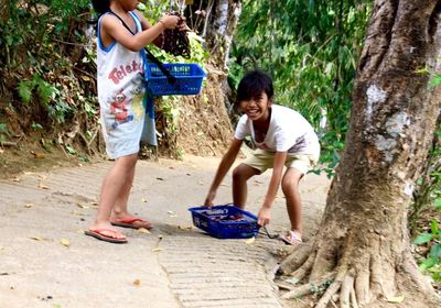 Full length of children on ground