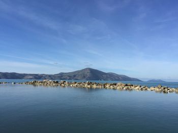 Scenic view of sea against blue sky