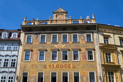 Low angle view of building against blue sky