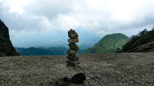 Stone pyramid or balancing rock in mountain