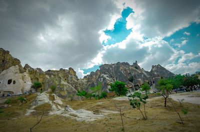 Scenic view of mountains against cloudy sky