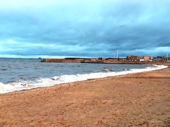 Scenic view of beach against sky