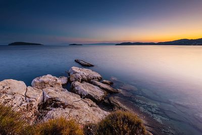 Scenic view of sea against sky at sunset