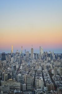 Cityscape against sky during sunset