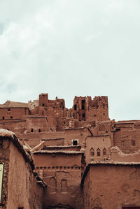 Low angle view of old fort against sky