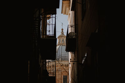 Low angle view of buildings in city against sky