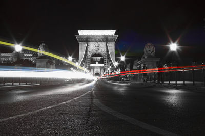 Light trails on suspension bridge at night