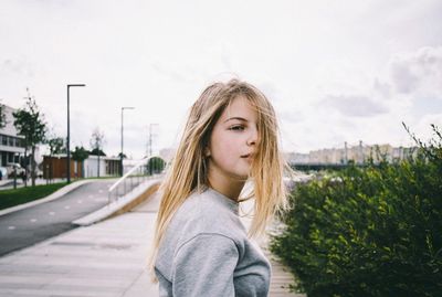 Portrait of woman standing on grass