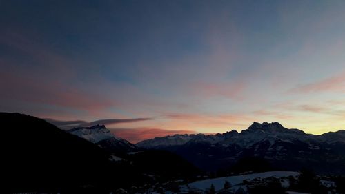 Scenic view of mountains against sky during sunset