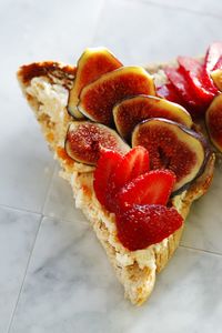 Close-up of fresh sliced fruits on cake