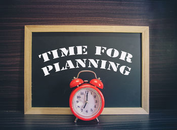 Close-up of clock on table