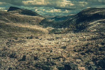 Aerial view of landscape against cloudy sky